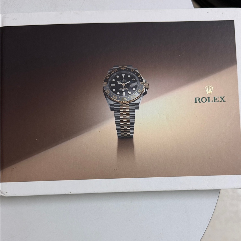 Rolex catalog book Rolex 2023/24Two-Tone Watch with Black Dial and Gold Accents